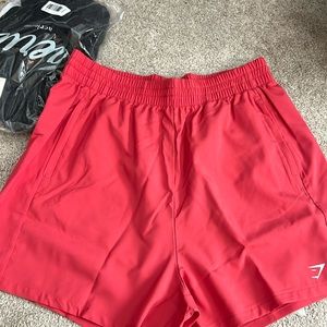 Men’s gym shark shorts, medium, new, 5” inseam, more salmon colored than red